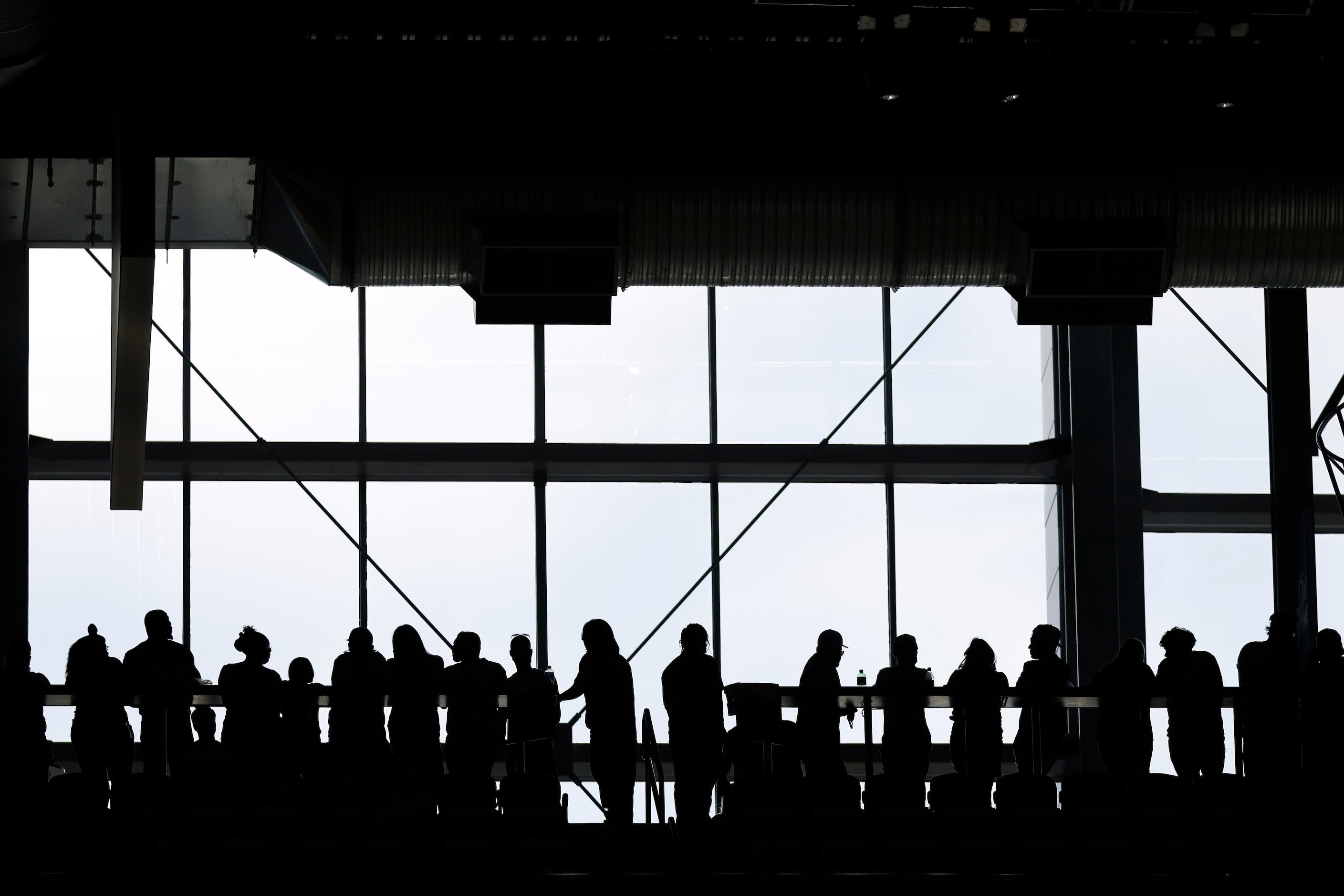 Dallas Cowboys fans line the upper balcony after rushing to get their standing room only...