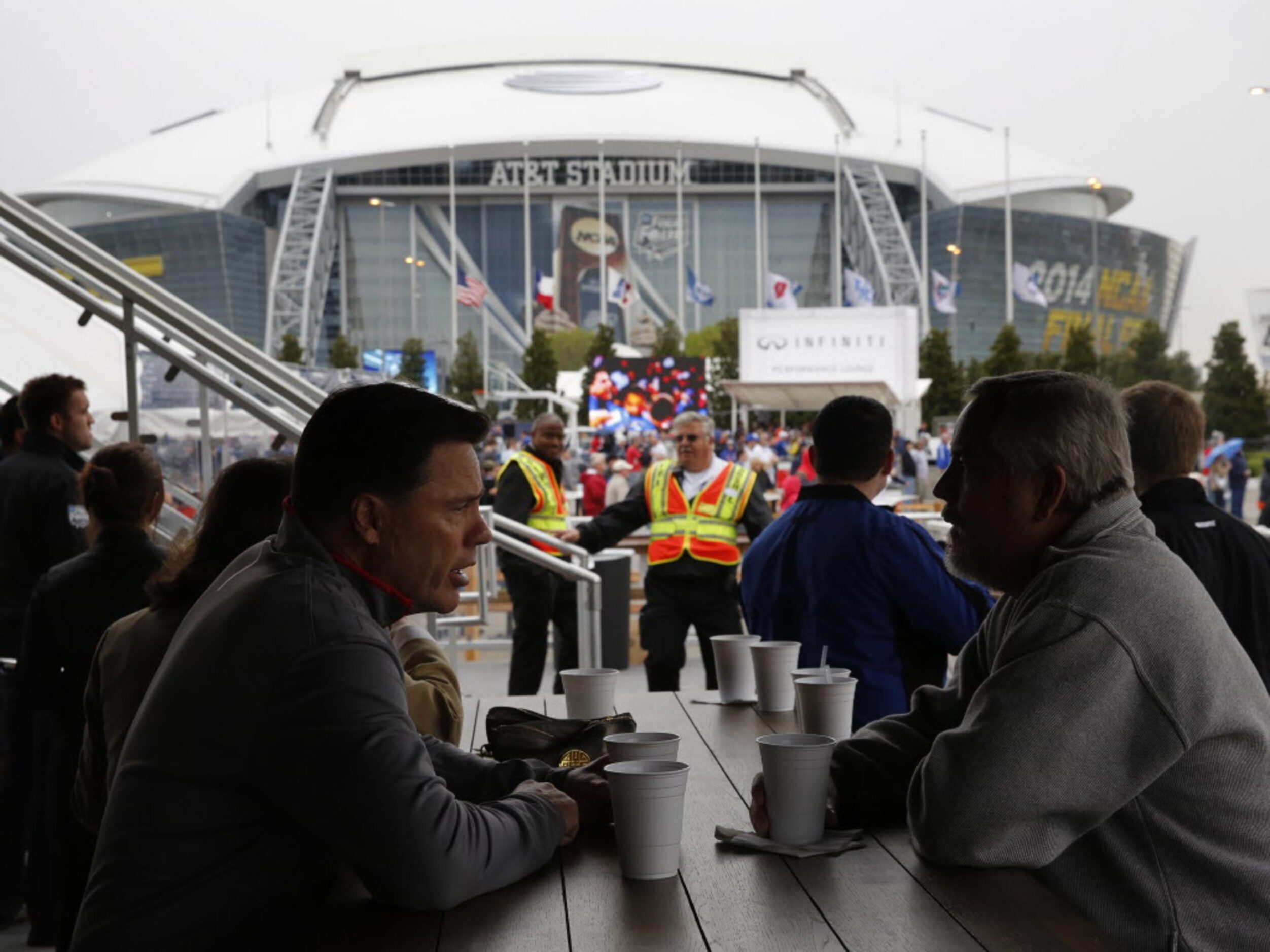 Fans relax in the Tip-Off Tailgate party before the NCAA Final Four at AT&T Stadium in...