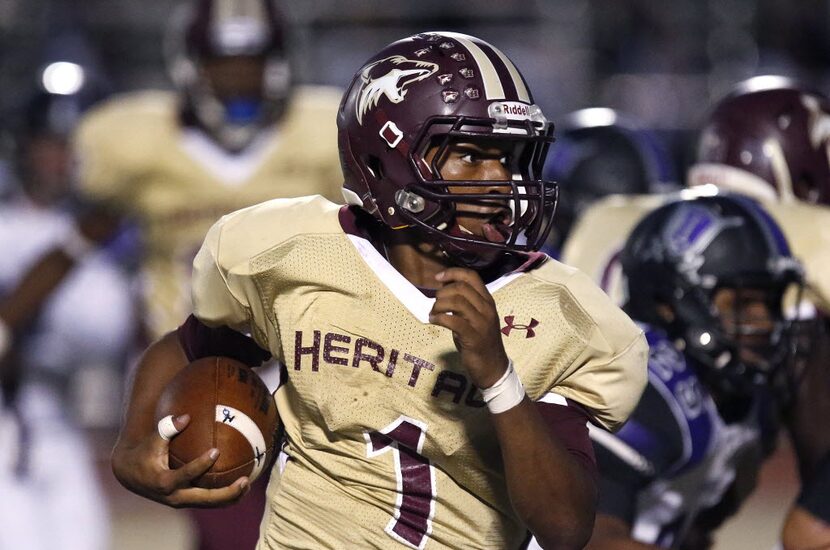 Heritage quarterback Amare Jones (1) looks for room to run in the first quarter as Frisco...