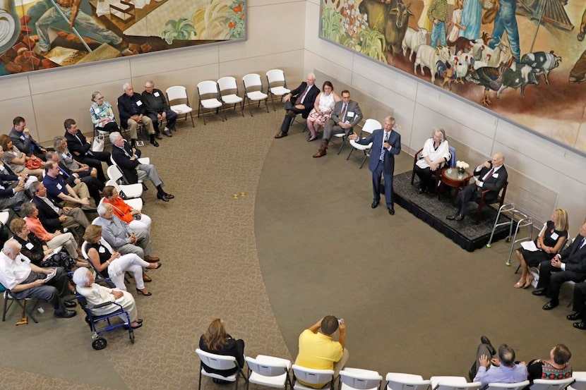 
Jim Moroney (center), publisher and CEO of The Dallas Morning News, honors Bob at his...