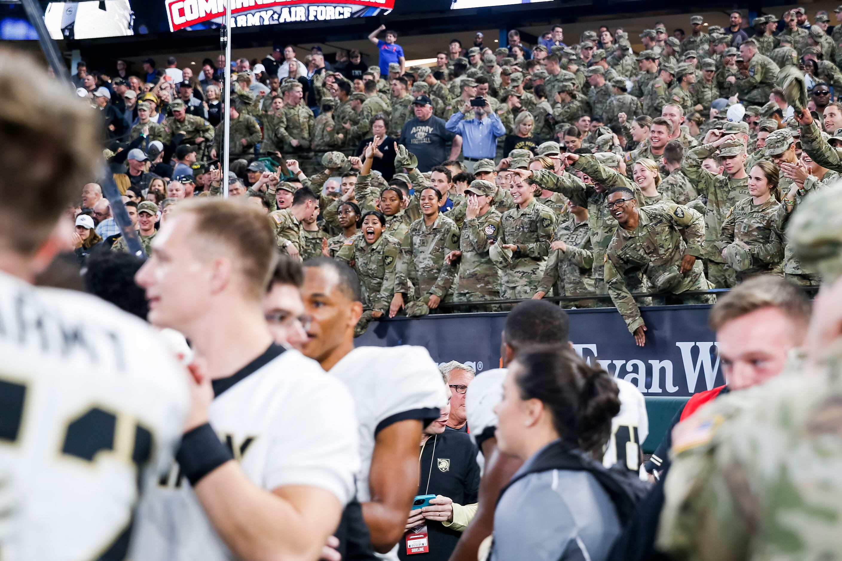 Army Black Knights players and cadets celebrate winning during overtime of the 2021 Lockheed...