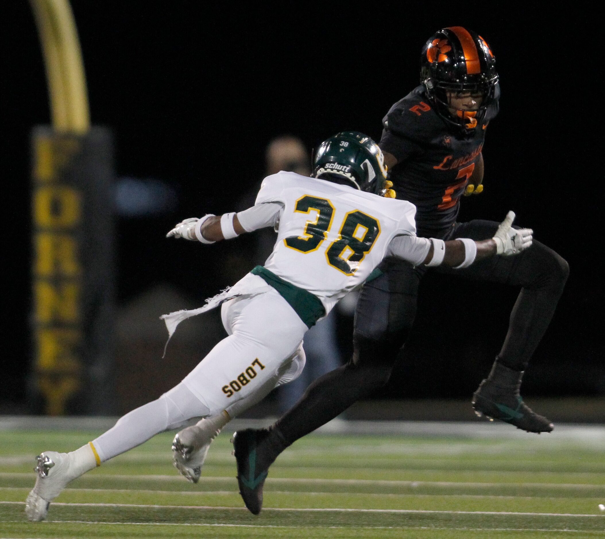 Lancaster running back Kewan Lacy (2), high steps the defensive pursuit of Longview...