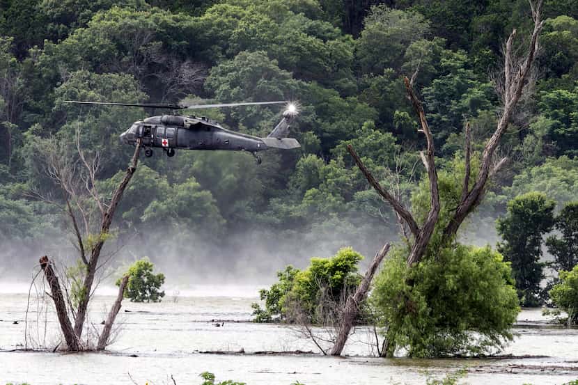 An Army helicopter hovered above Lake Belton on June 3, 2016, during the search for missing...