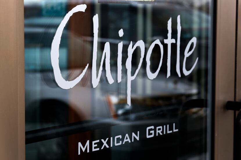 FILE - This Tuesday, Jan. 28, 2014 file photo, shows the door on a Chipotle Mexican Grill in...