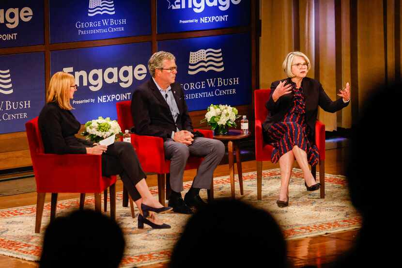 Moderator and Bush Institute executive director Holly Kuzmich (left) speaks with former...