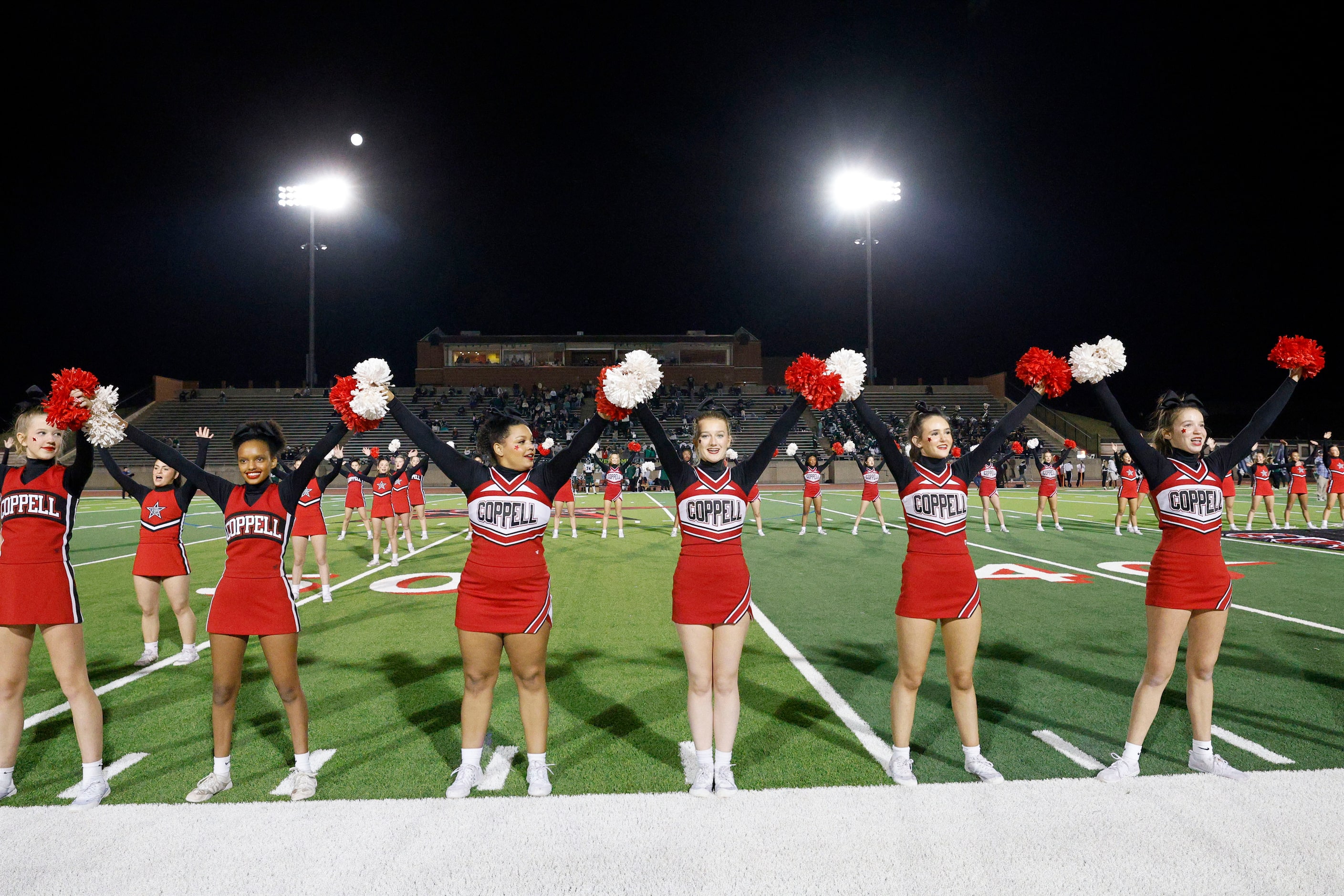 Coppell cheerleaders perform before a high school football game against Prosper at Buddy...