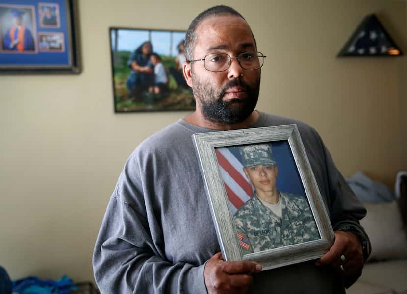 Ricky DeLeon holds a portrait of his late son, Isaac Lee DeLeon, at his home in San Angelo.