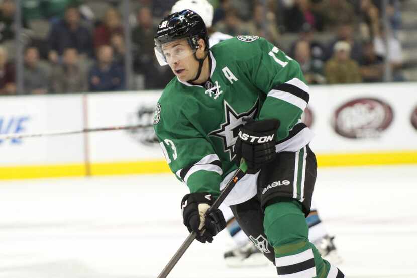 DALLAS, TX - OCTOBER 17:  Ray Whitney #13 of the Dallas Stars brings the puck up ice against...
