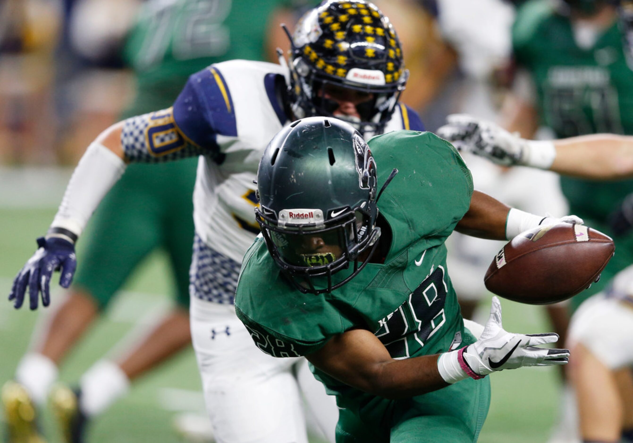 Kennedale's DJ Kirven (28) runs into the end zone for a touchdown as Stephenville's Zane...