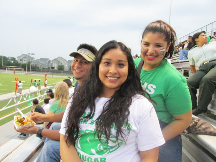 Bryan Adams counselor Joel Ledezma (left), Esmeralda Cortez and student Janelle Torres cheer...