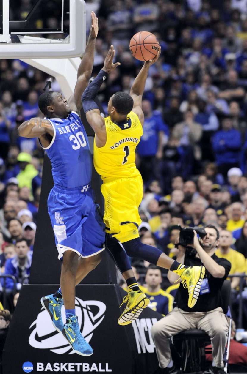 Mar 30, 2014; Indianapolis, IN, USA; Michigan Wolverines forward Glenn Robinson III (1)...