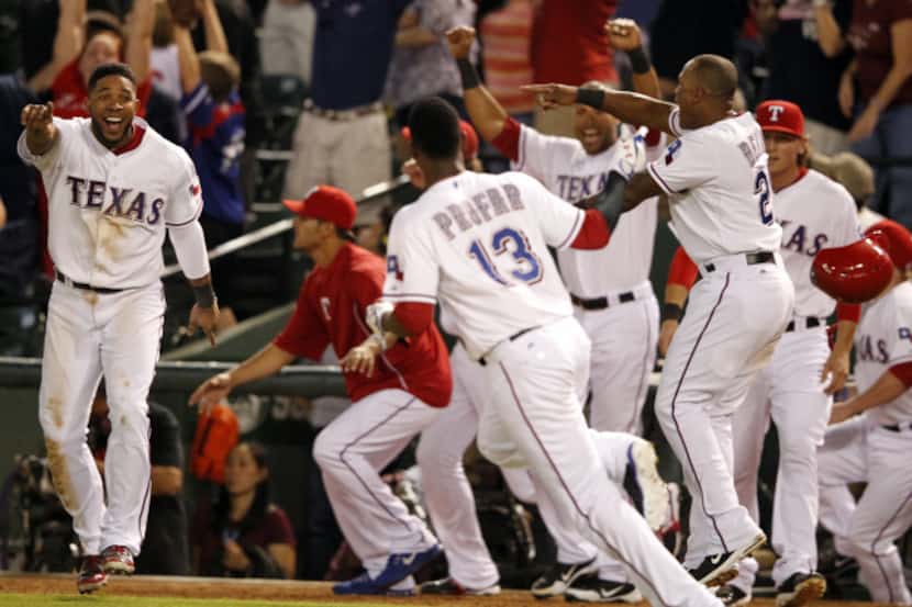 Texas Rangers relief pitcher Neal Cotts (56) reacts after he allowed a two-run home run to...