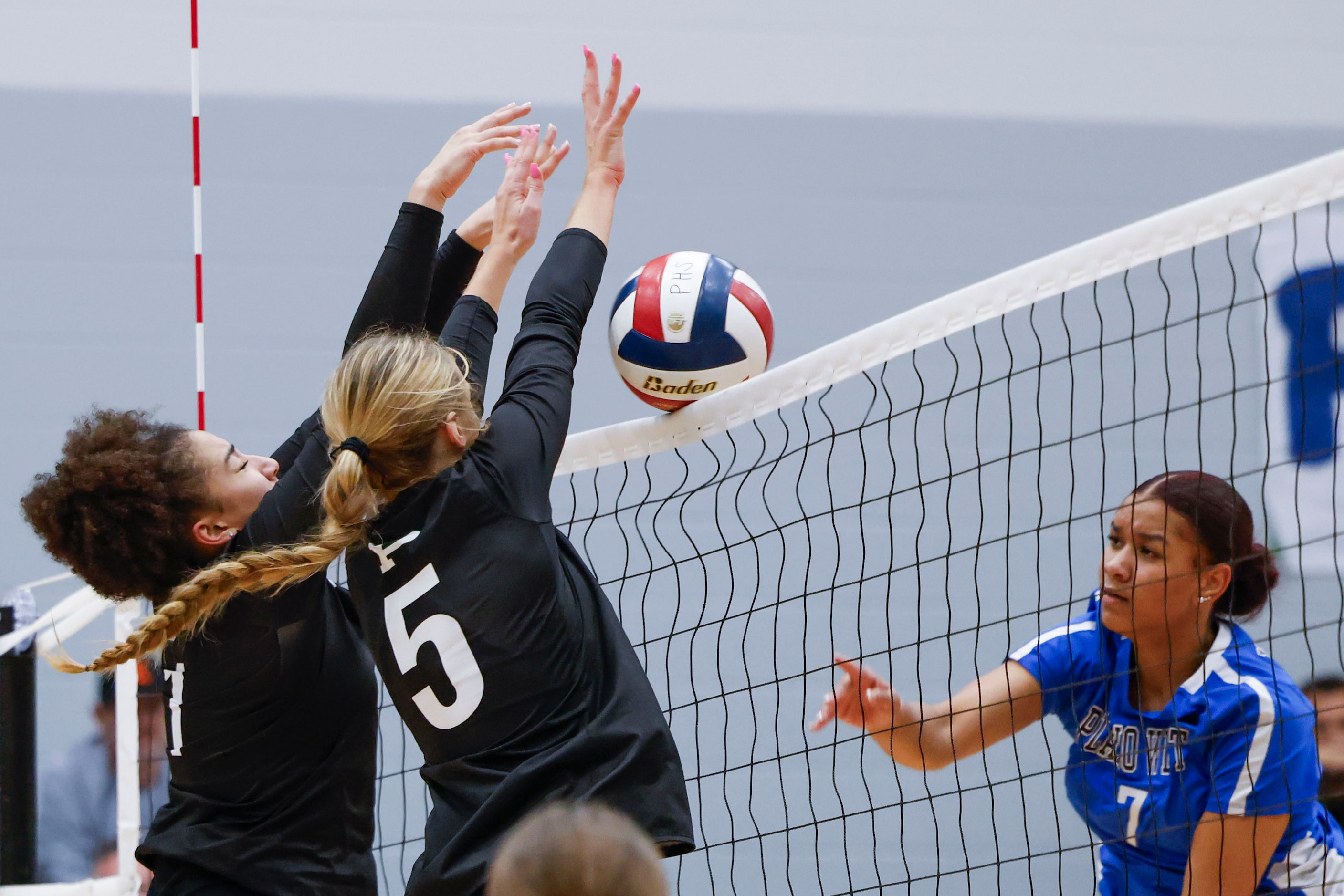 Prosper high school’s Jayla Jackson (left) and Sydney Thornton (middle) blocks a hit of...