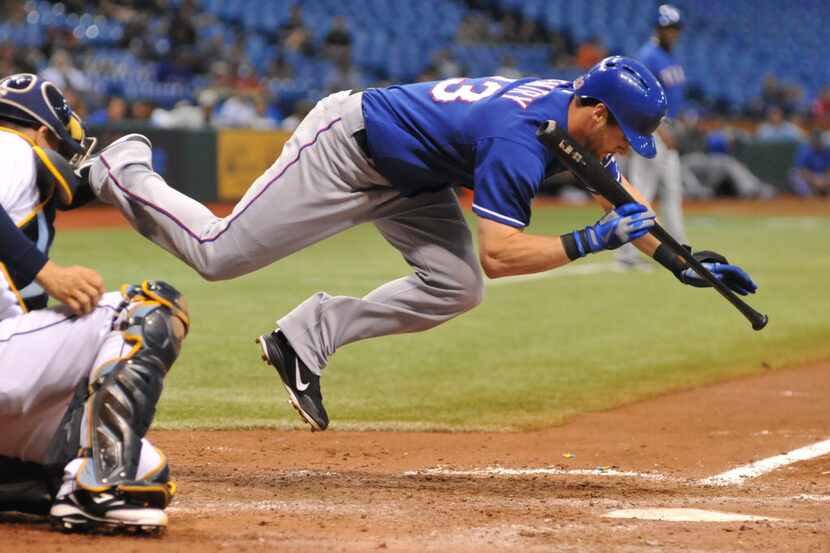ST. PETERSBURG, FL - SEPTEMBER 18: Outfielder Craig Gentry #23  of the Texas Rangers dives...
