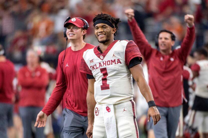 Oklahoma quarterback Kyler Murray (1) celebrates on the sidelines after throwing a touchdown...