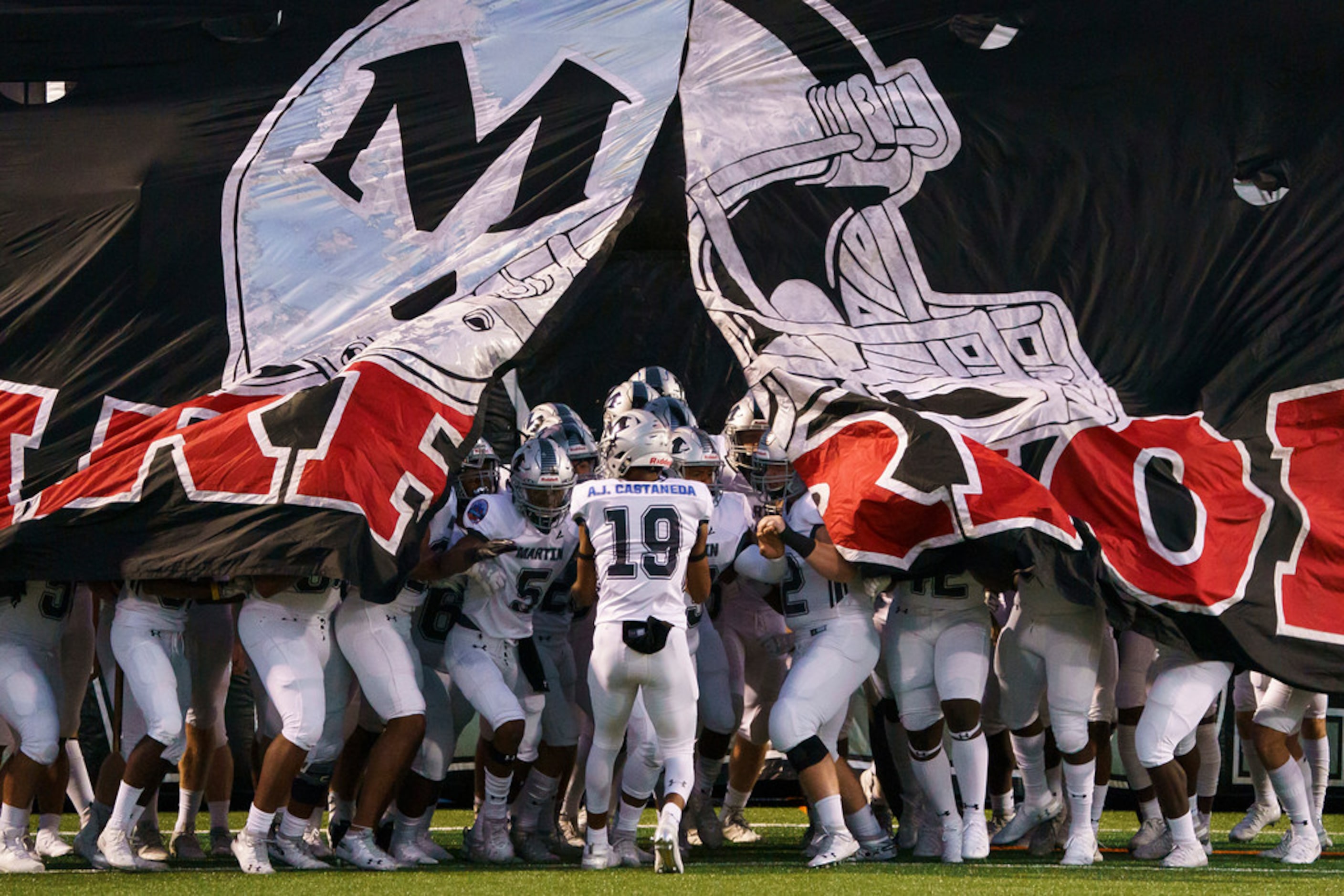 Arlington Martin players wear jerseys honoring Grand Prairie police officer A.J. Castaneda,...