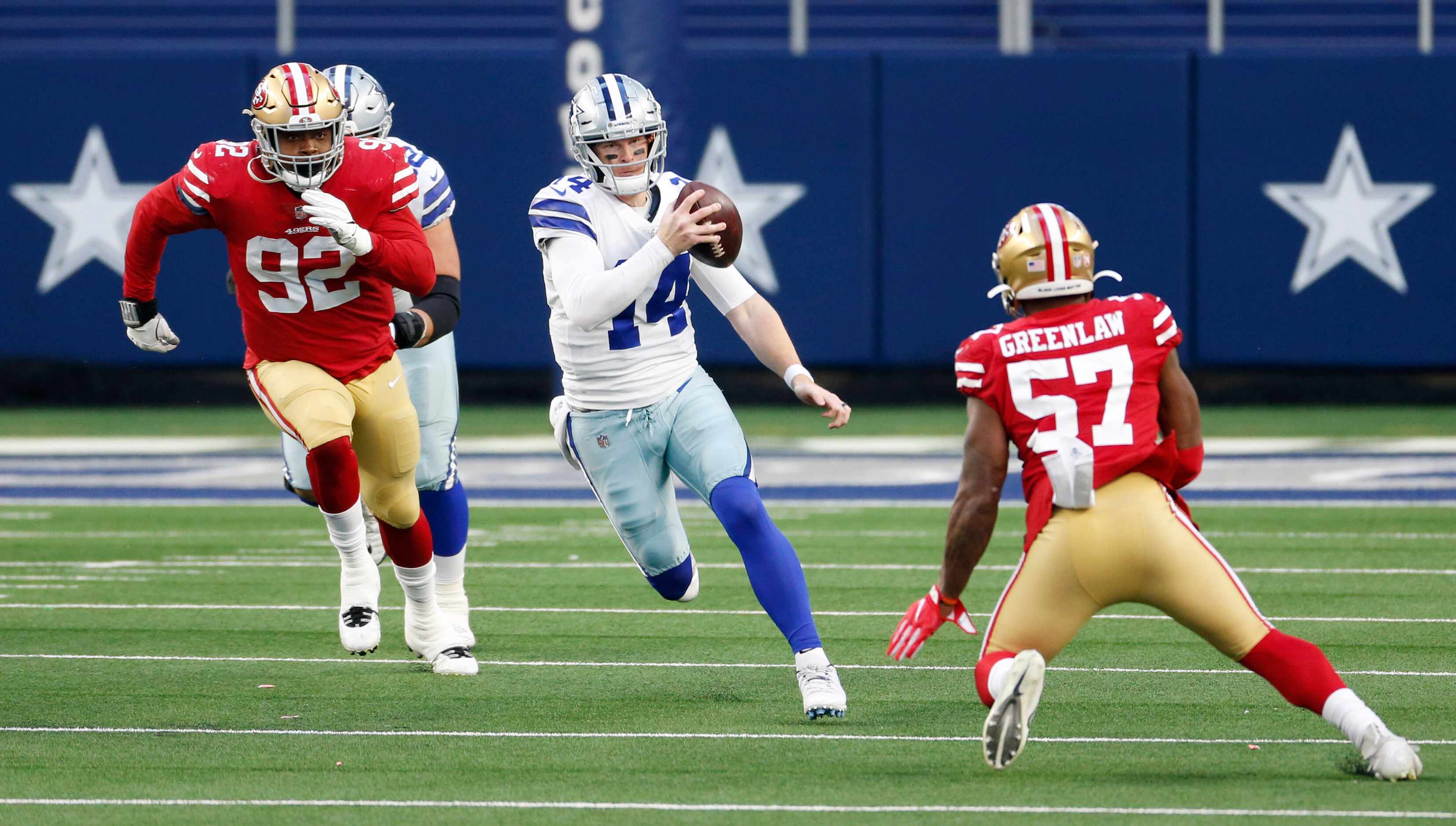 Dallas Cowboys quarterback Andy Dalton (14) runs up the field as San Francisco 49ers outside...