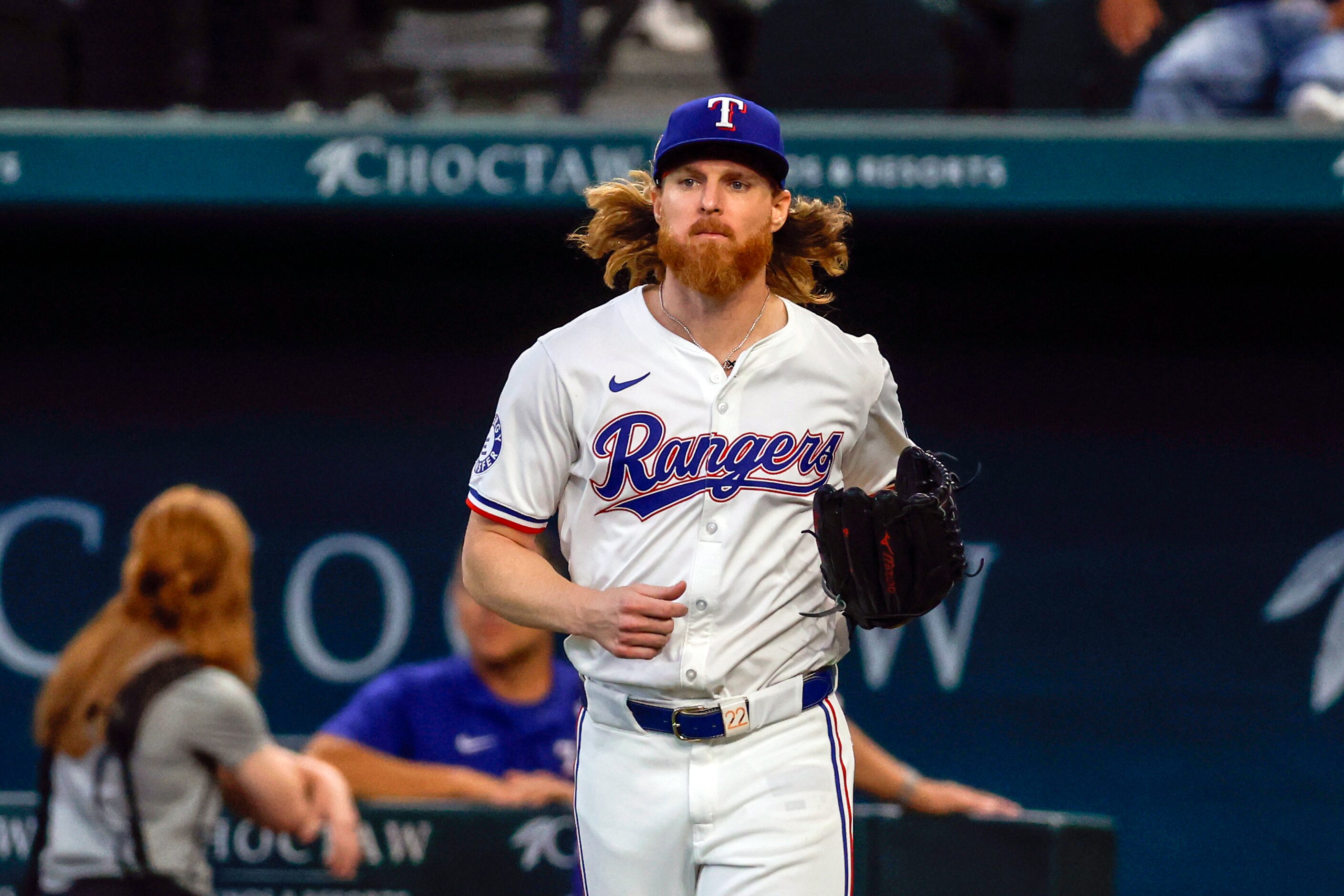 Texas Rangers starting pitcher Jon Gray (22) jogs to the mound before the first inning of an...