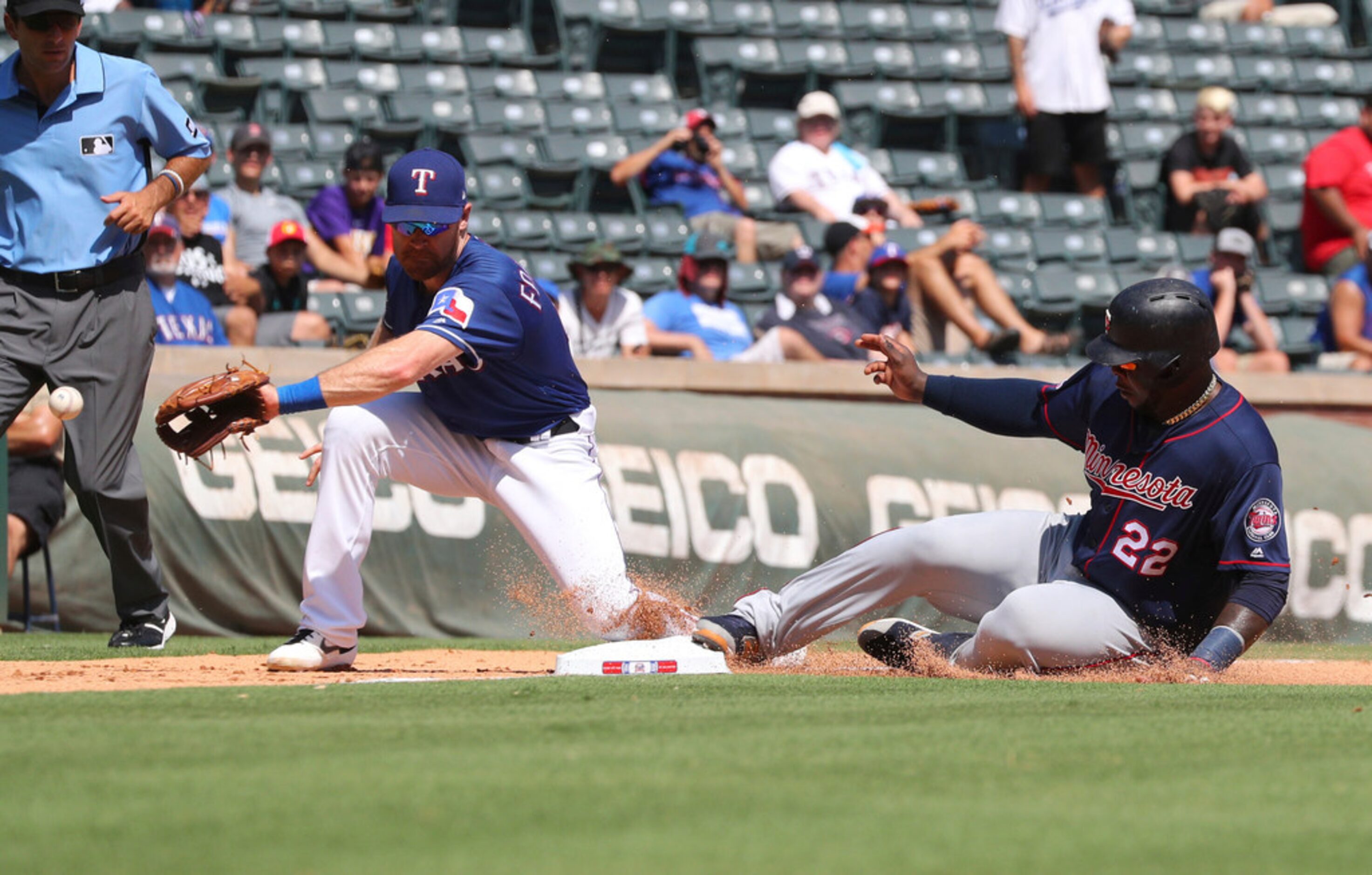 Texas Rangers third baseman Logan Forsythe (41) gets the ball late as Minnesota Twins third...