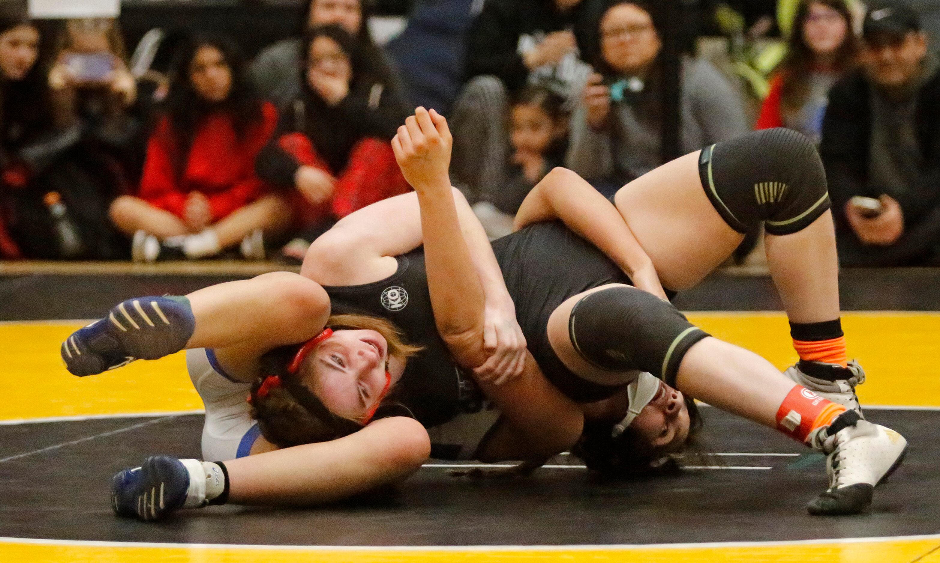 Mercede Alvarez (top) of Frisco Liberty High School competes with Jalene Romero of Burleson...