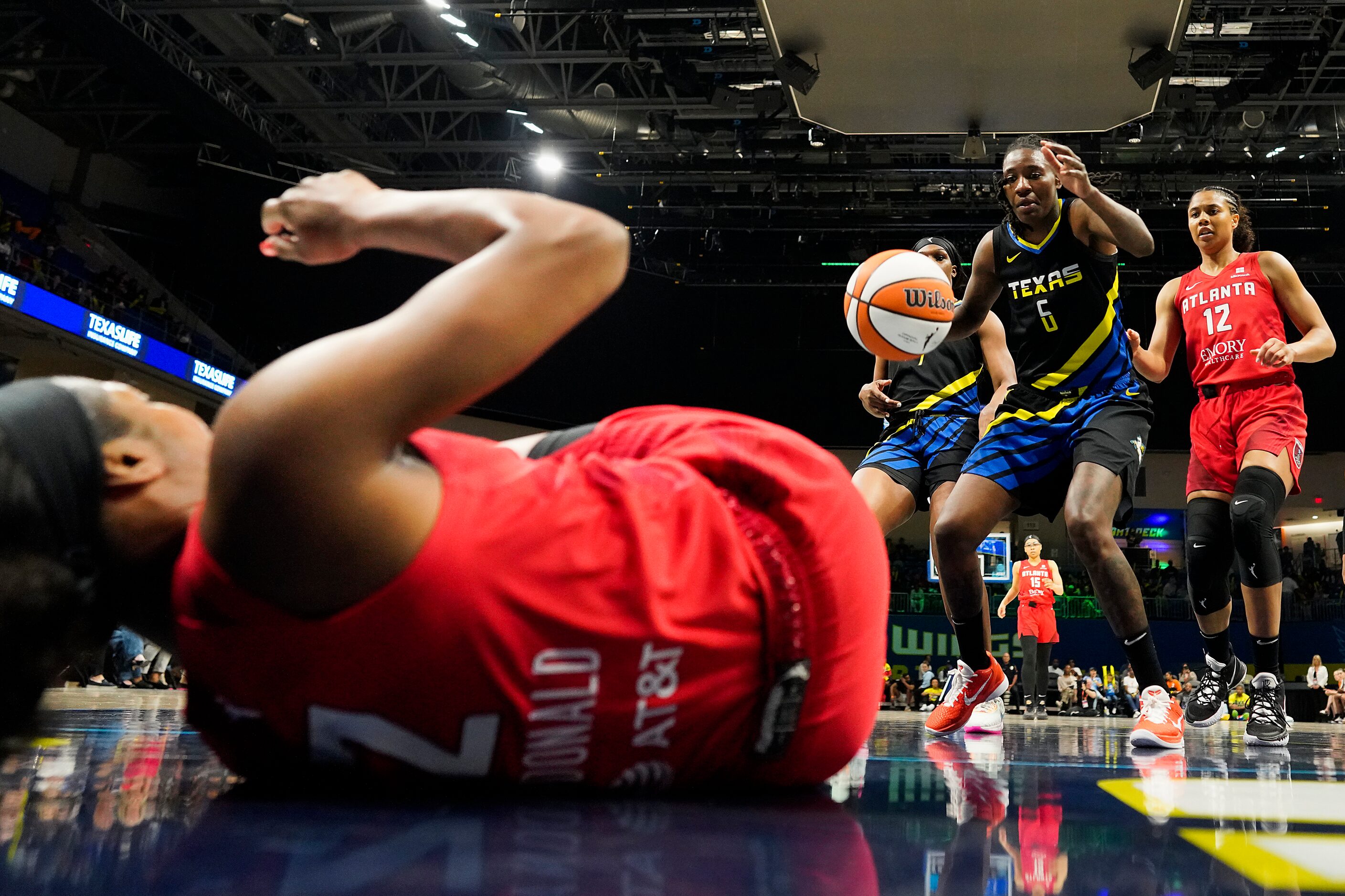 Dallas Wings forward Natasha Howard (6) grabs a loose ball from Atlanta Dream guard Danielle...