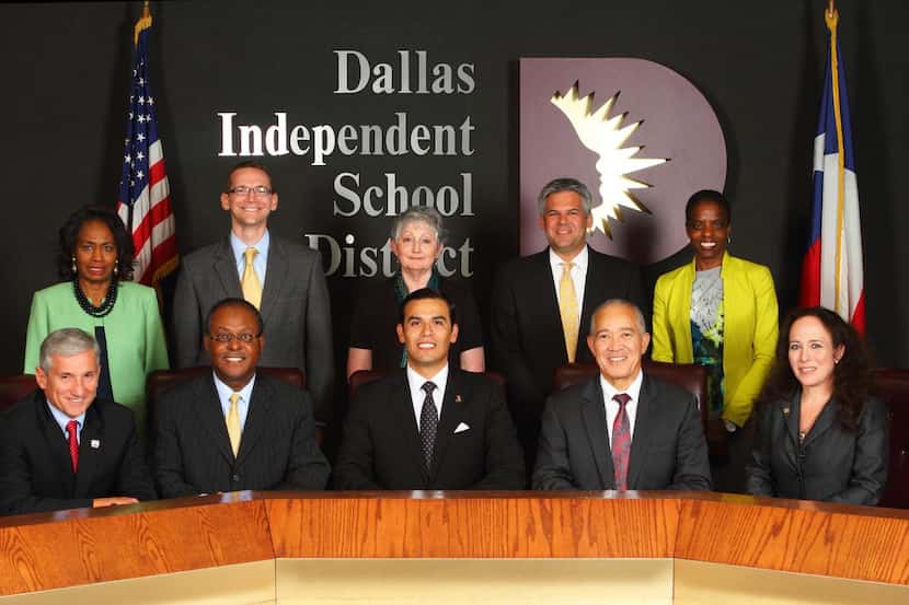 
The Dallas school board, shown with Superintendent Mike Miles (front, second from right),...