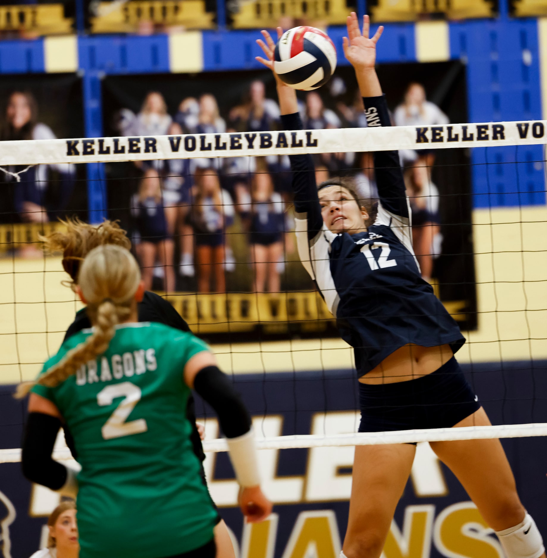 Keller’s Anna Flores (12) returns the ball to Southlake Carroll during the first set of a...