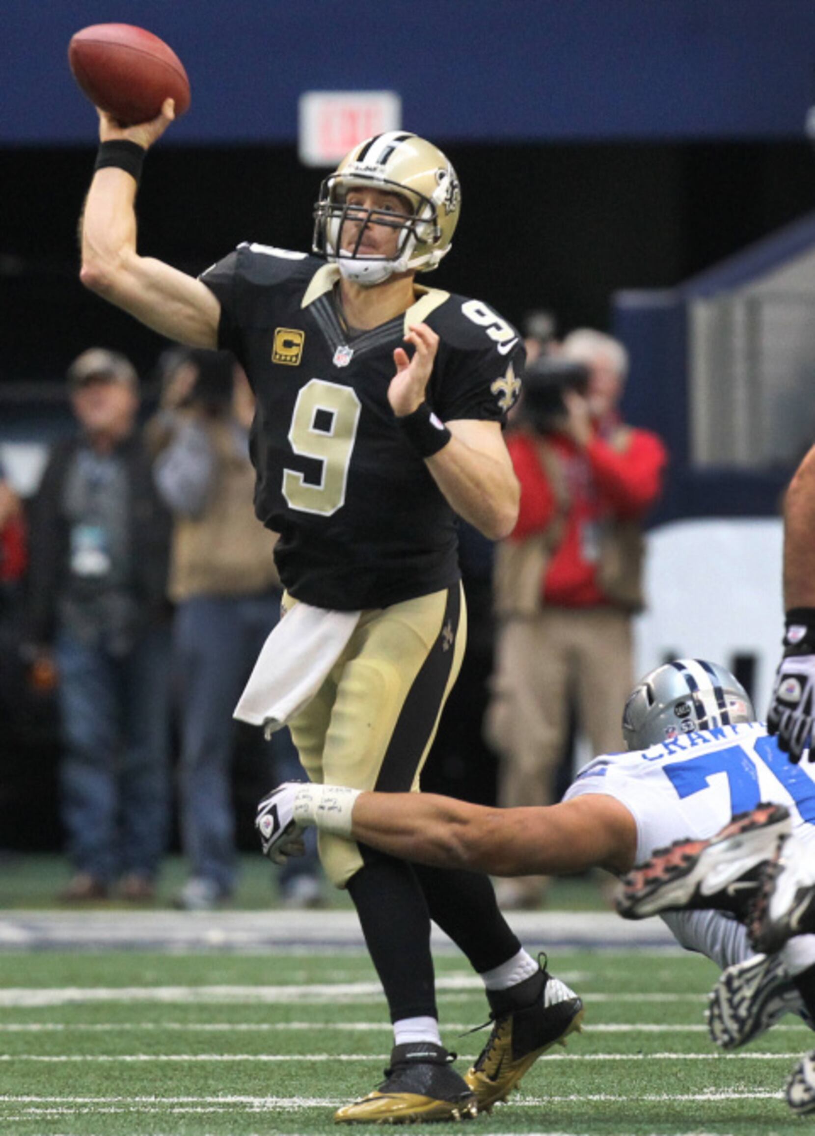 Dallas Cowboys free safety Gerald Sensabaugh (43) tries to bring down New  Orleans Saints wide receiver Marques Colston (12) during the first half of  an NFL football game Sunday, Dec. 23, 2012