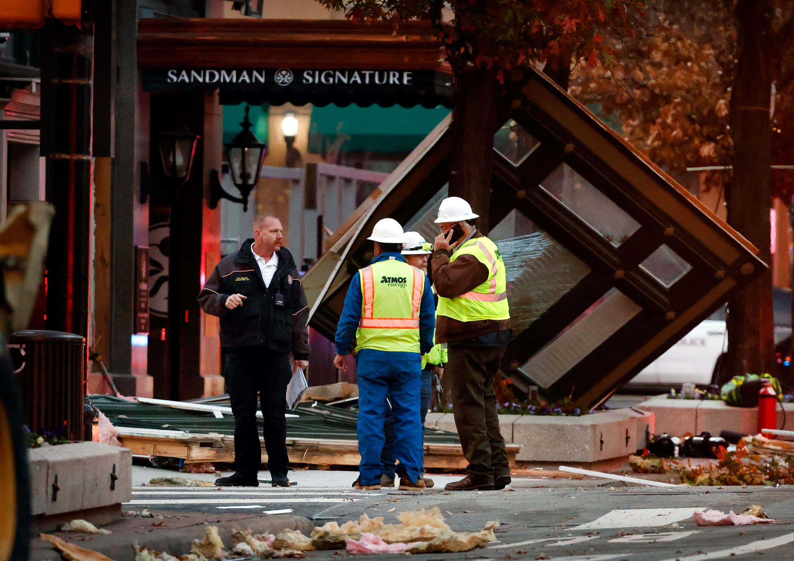 Atmos Energy and Fort Worth Fire officials examine the site on Houston St where an explosion...