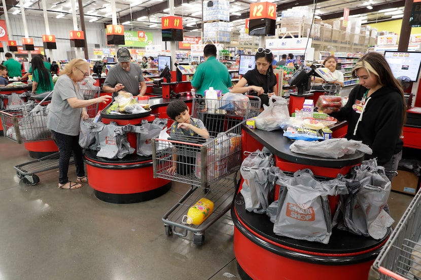 Customers checking out at Joe V's Smart Shop in Pasadena, near Houston.   Joe V’s cater to...