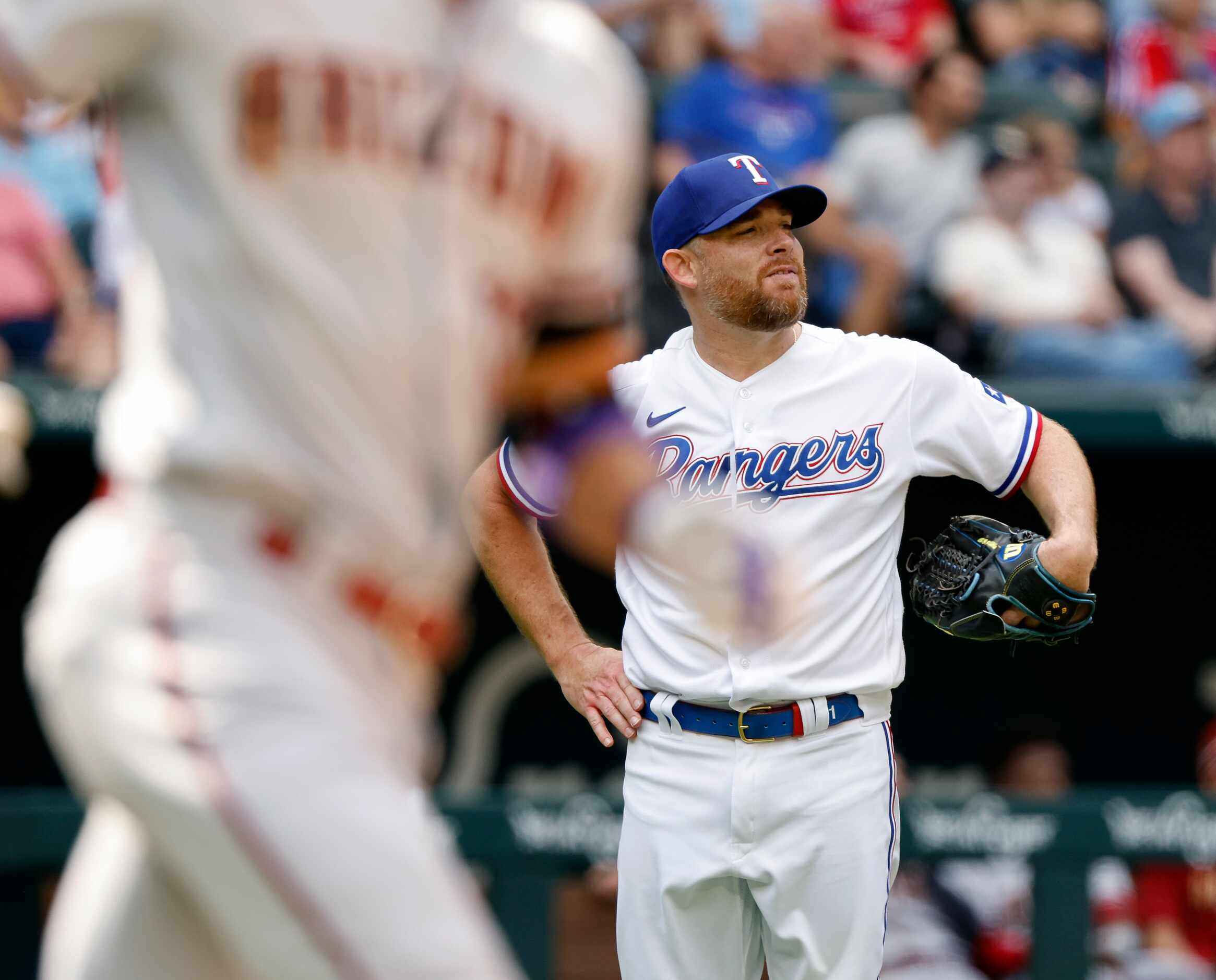 Texas Rangers relief pitcher Ian Kennedy (right) watches Arizona Diamondbacks Lourdes...