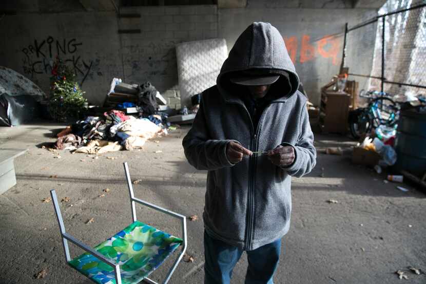 A man who is addicted to heroin and the opioid fentanyl is pictured in a tent city along the...