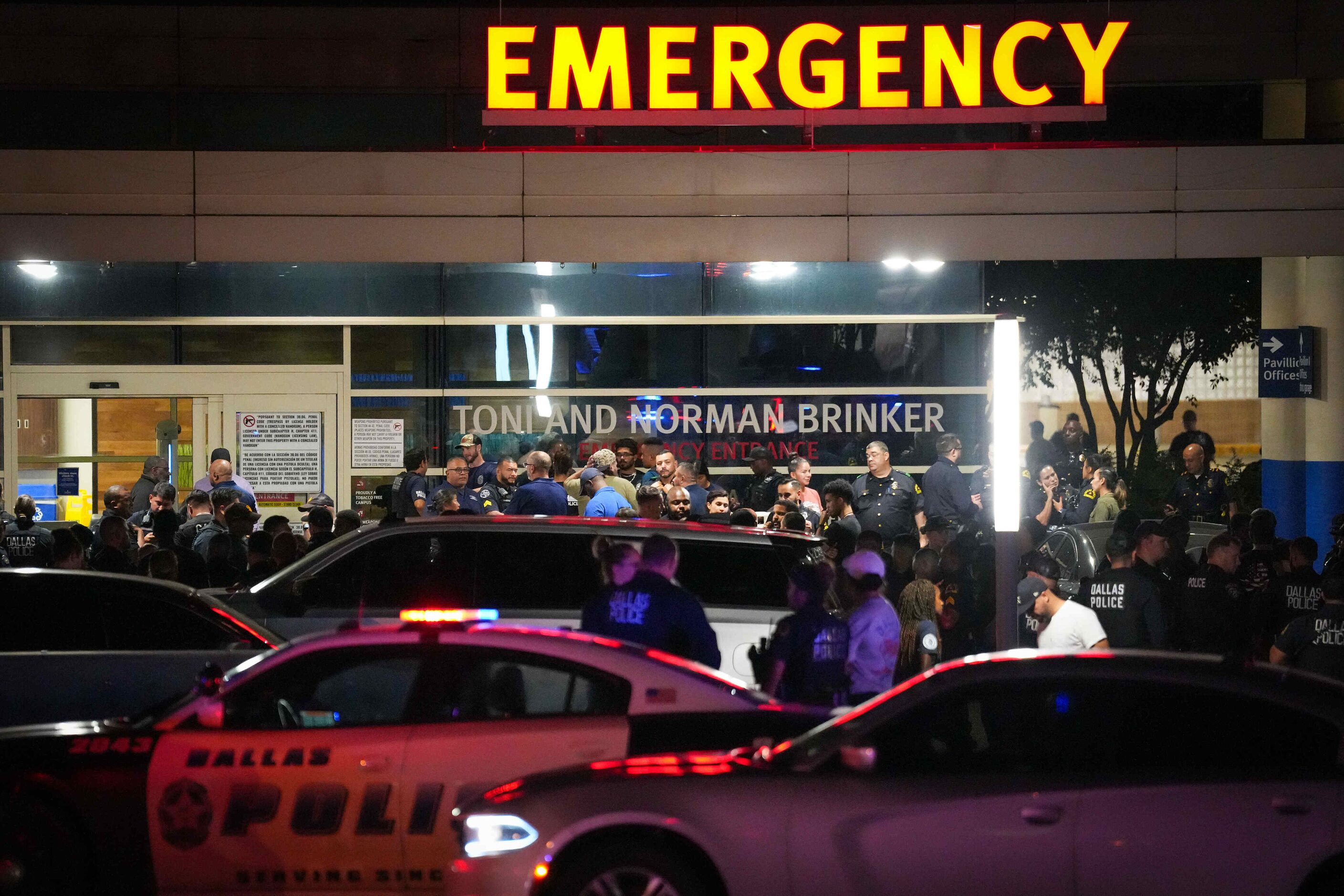 Dallas police gather at Methodist Dallas Medical Center in the early morning hours of...