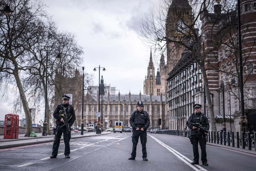 Police officers secure the area near the houses of Parliament in London, March 22, 2017. An...