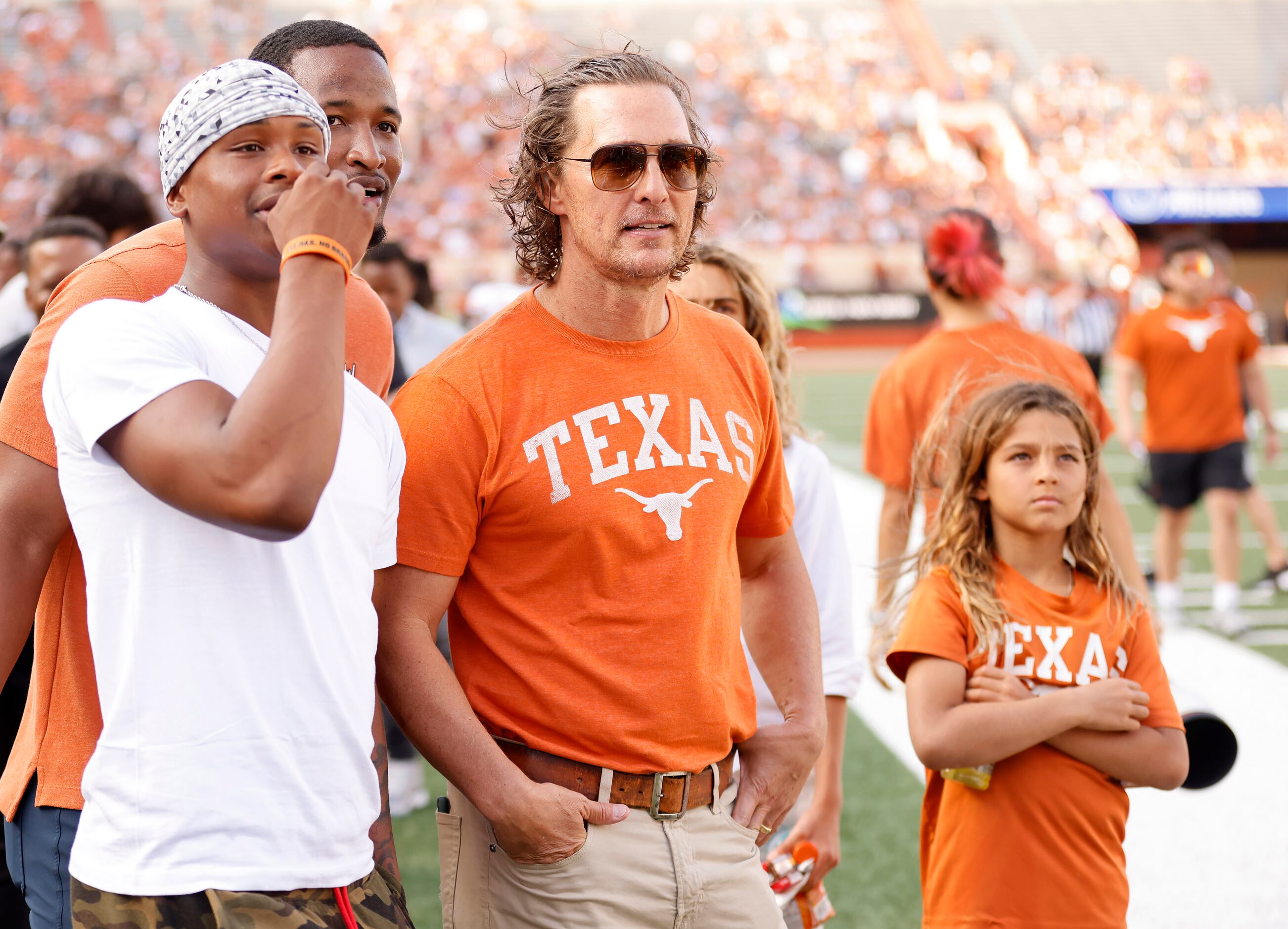 Texas Longhorns Minister of Culture Matthew McConaughey (center) watches the Orange-White...