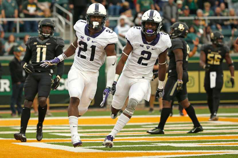 WACO, TX - NOVEMBER 5:  Kyle Hicks #21 of the TCU Horned Frogs celebrates with teammate...