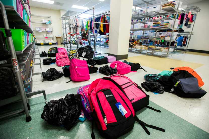 Clothing, toy and school supplies donations are stored in a large "closet" on Thursday,...
