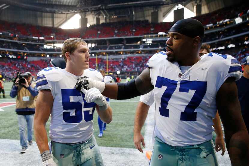 Dallas Cowboys offensive tackle Tyron Smith (77) talks to Dallas Cowboys outside linebacker...