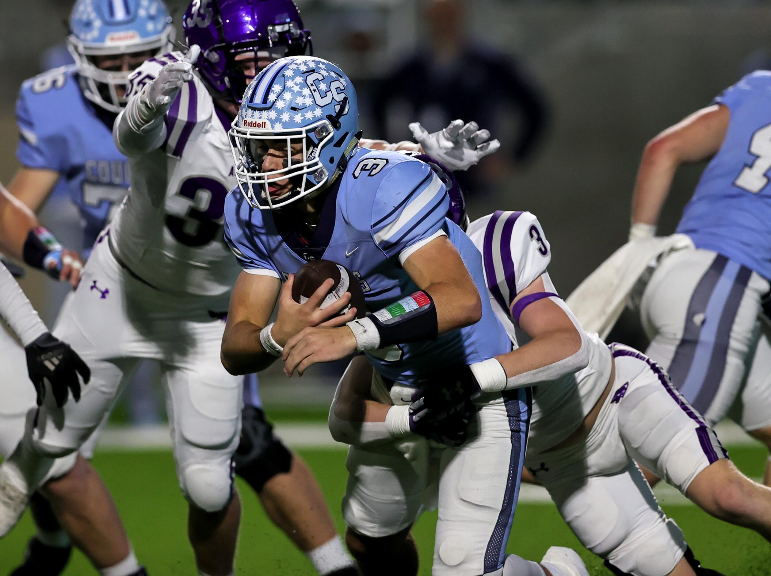 China Spring quarterback Cash McCollum (3) gets sacked by Anna safety Grant Cerveny, (right)...