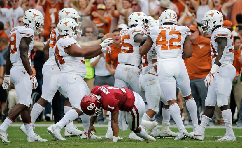 FILE - Oklahoma quarterback Kyler Murray (1) gets up slowly off the turf as the Texas...