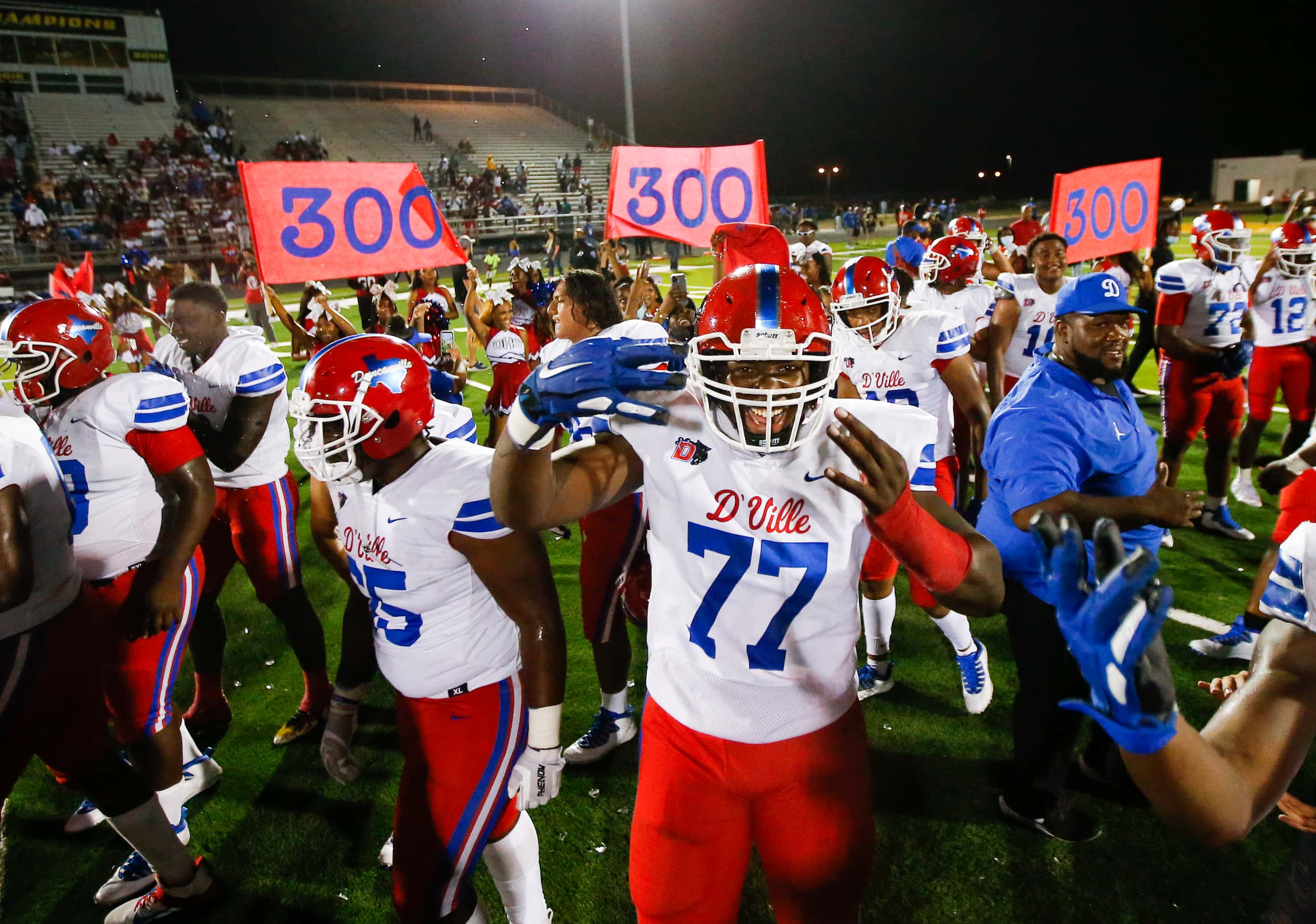 Duncanville celebrates a 42-21 win over DeSoto after a high school football game at DeSoto...