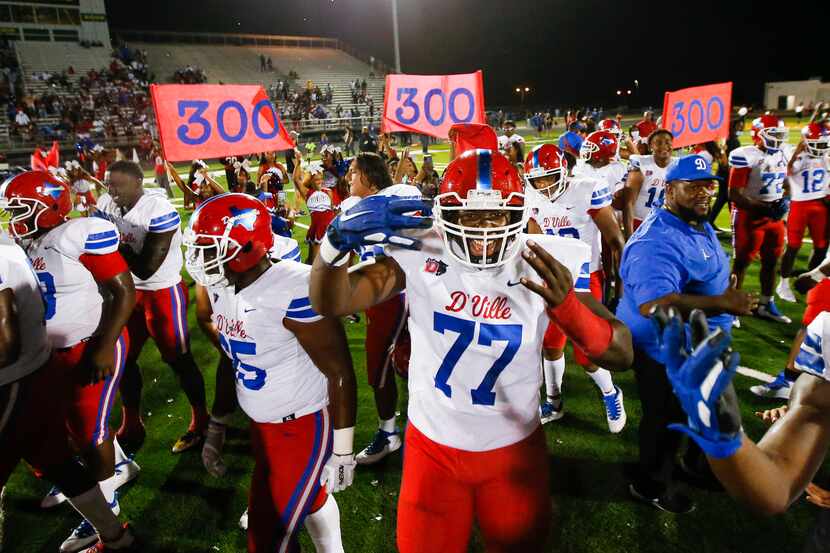 Duncanville celebrates a 42-21 win over DeSoto after a high school football game at DeSoto...