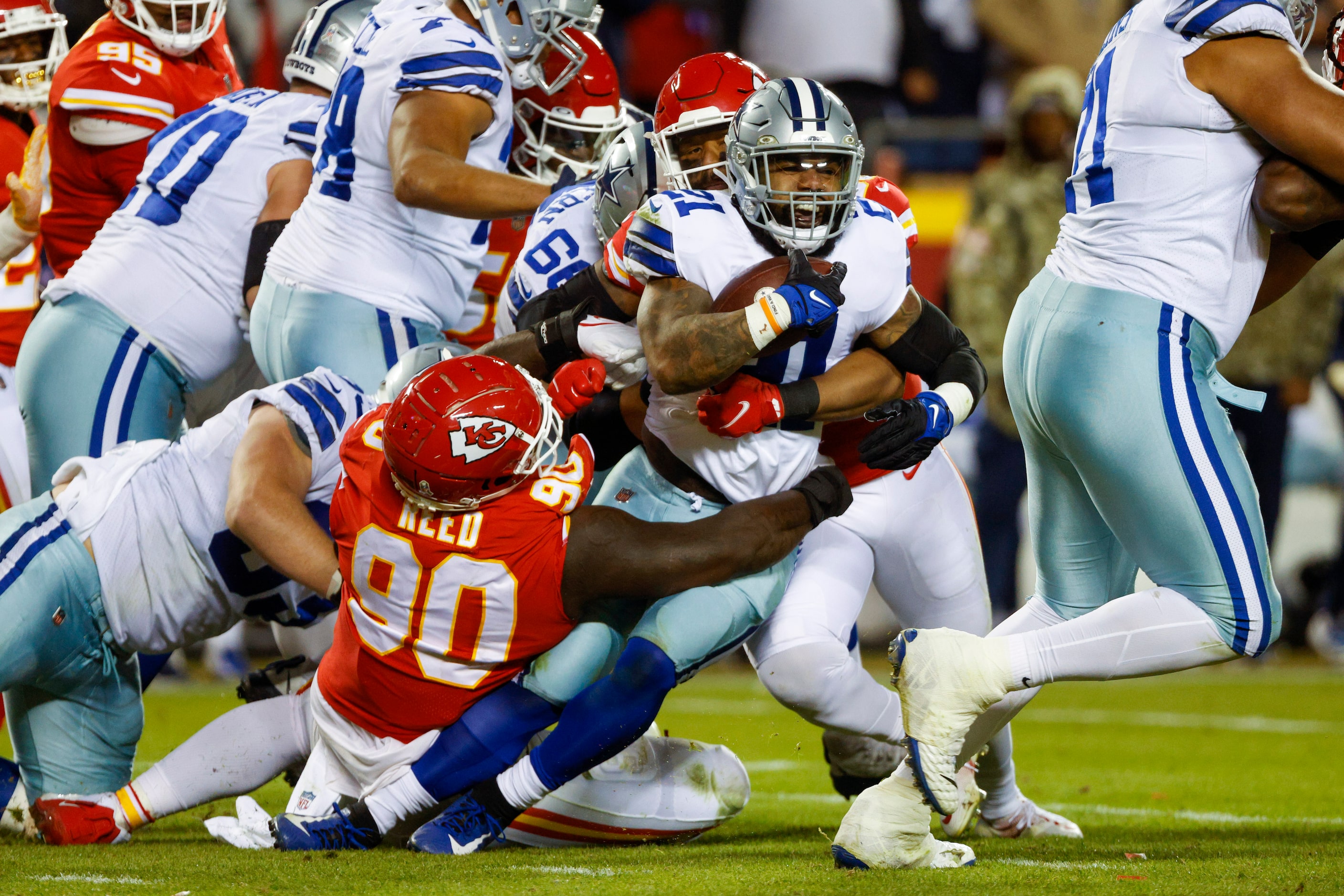 Kansas City Chiefs defensive tackle Jarran Reed (90) tackles Dallas Cowboys running back...