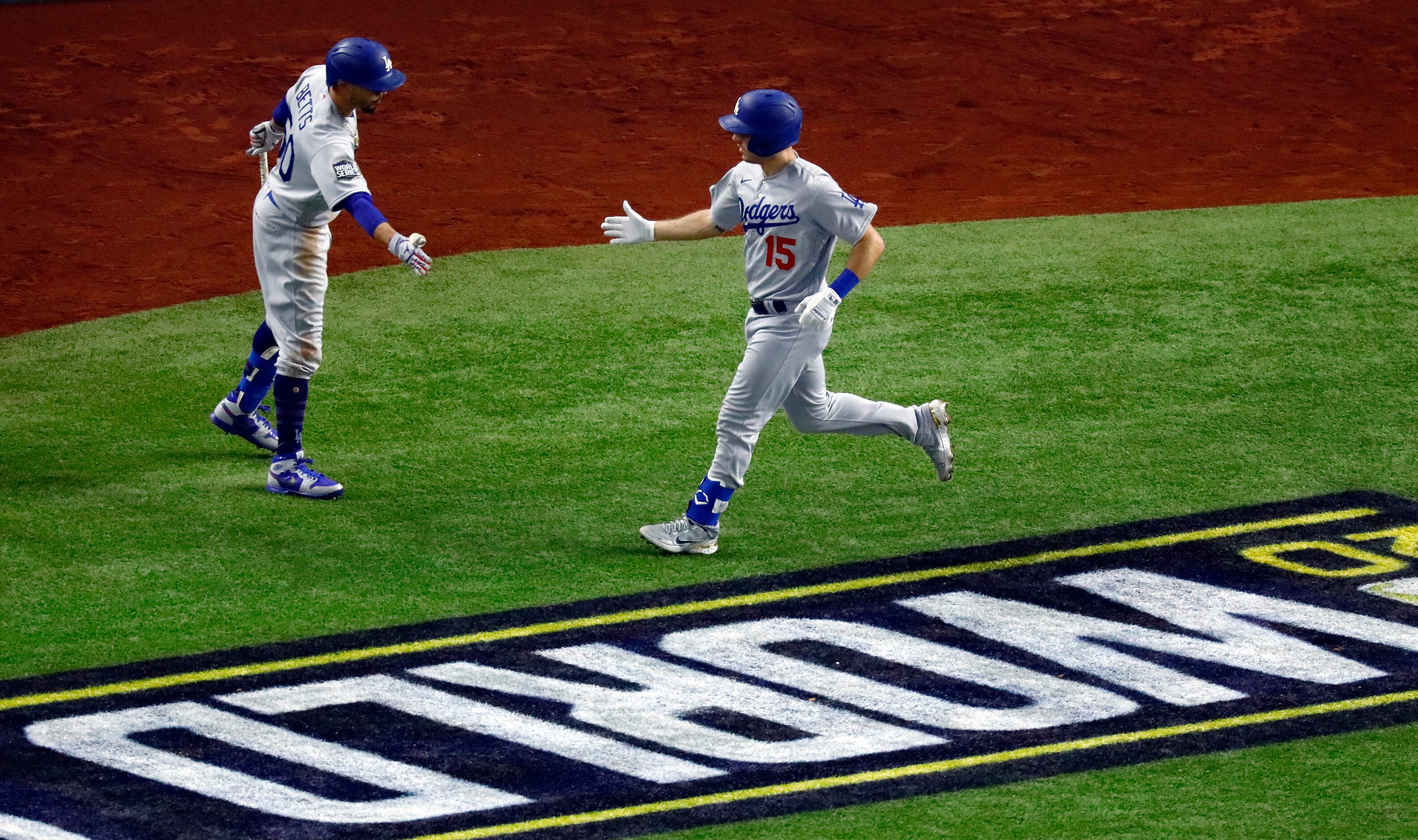 Los Angeles Dodgers Austin Barnes (15) is congratulated on his solo home run during the...