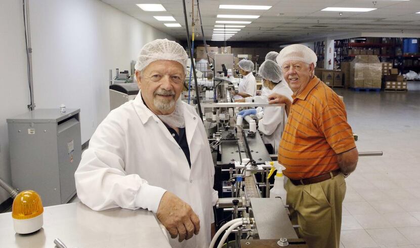 
George Harwell (left) and G.M. “Kirk” Kirkpatrick keep the machines going at Premark Health...