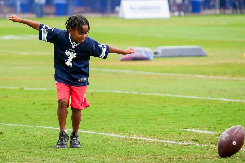 Aaiden Diggs celebrates after catching a pass from his dad, Dallas Cowboys cornerback Trevon...
