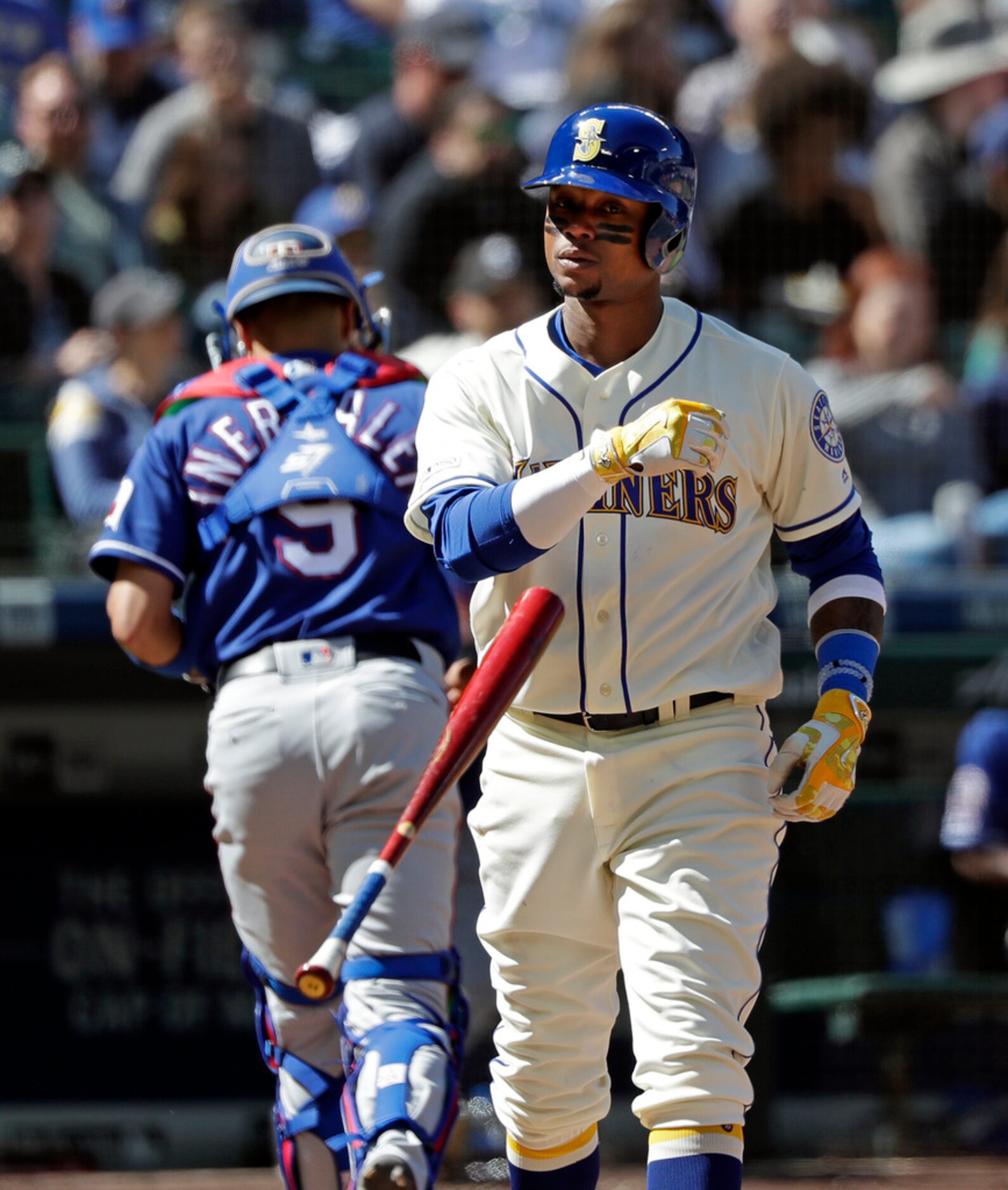 Seattle Mariners' Tim Beckham tosses aside his bat after striking out to end the sixth...