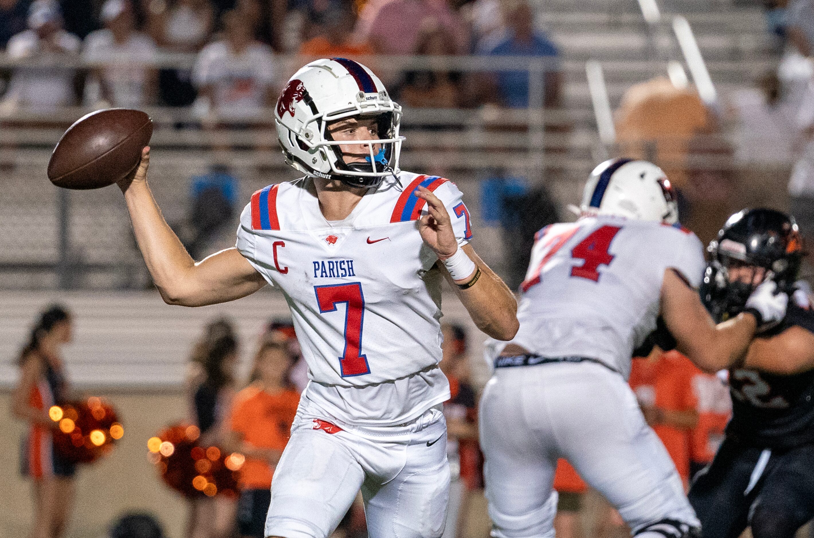 Parish Episcopal senior quarterback Sawyer Anderson (7) rolls out to pass during the first...