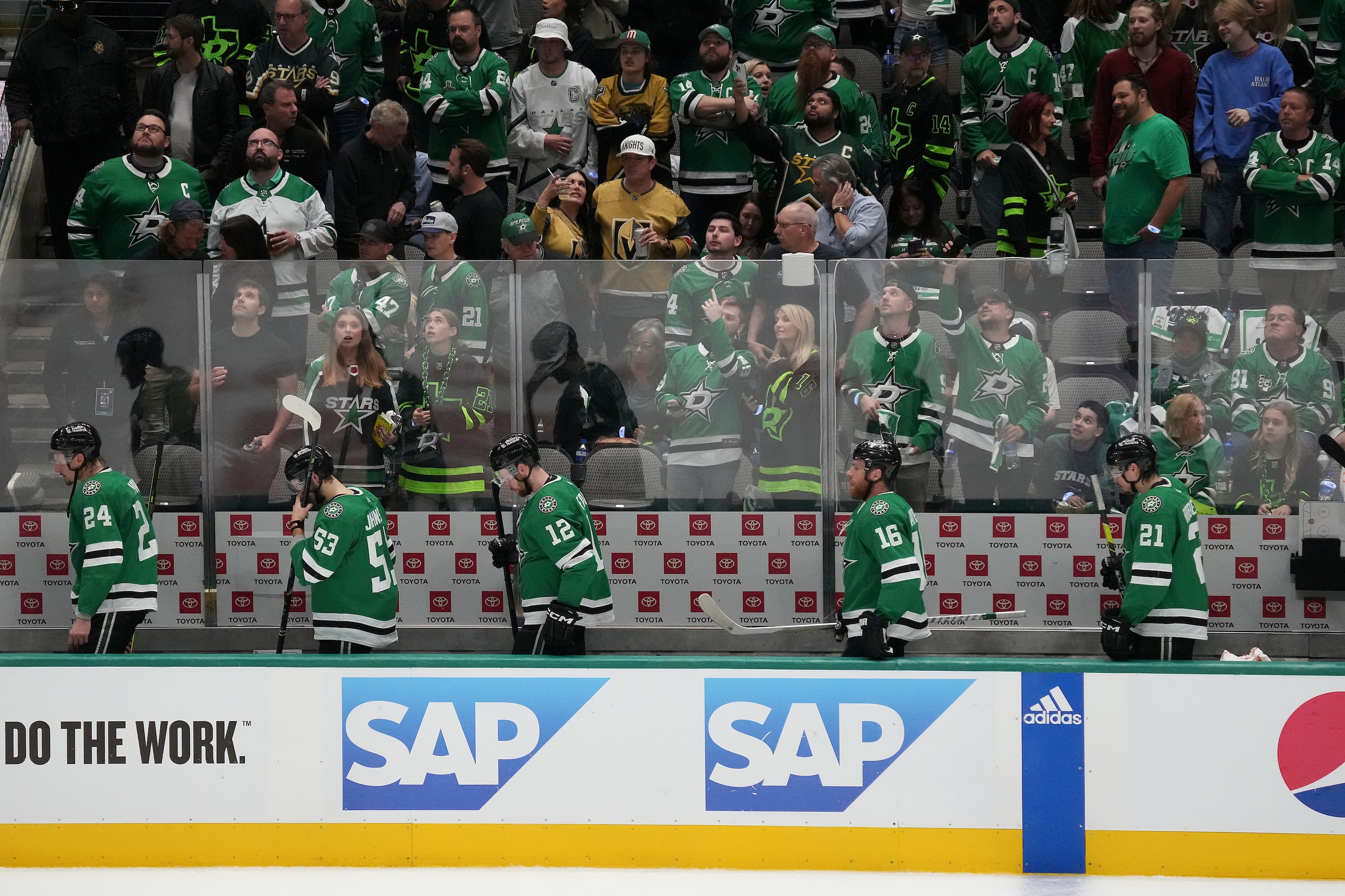  Dallas Stars players head to the bench with 21.6 seconds left in the second period in Game...