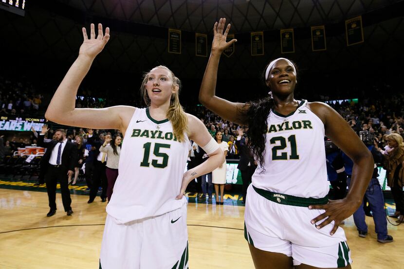 Baylor forward Lauren Cox (15) and center Kalani Brown (21) stand during the playing of the...